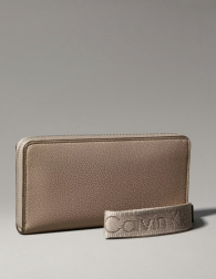 Жіночий гаманець Calvin Klein з ремінцем на руку 1159853902 (Бежевий One size)