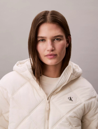 Жіноча стьобана куртка Calvin Klein 1159893467 (Молочний XL)