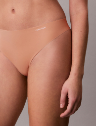 Бесшовные трусики тонг Calvin Klein с логотипом 1159853773 (Бежевый S)
