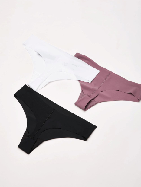 Женские бесшовные трусики тонг Calvin Klein набор 1159835631 (Разные цвета L)